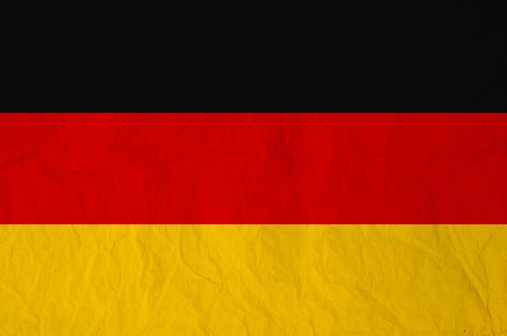 Photo drapeau de l'allemagne avec du vieux papier vintage