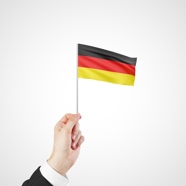 drapeau de l'Allemagne à la main