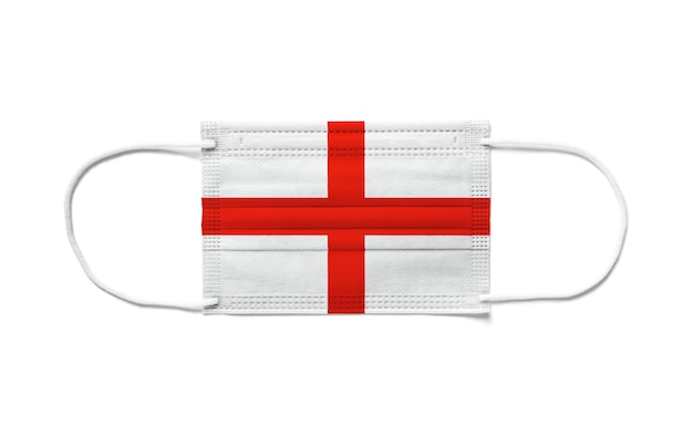 Drapeau de l'Angleterre sur un masque chirurgical jetable. Fond blanc isolé