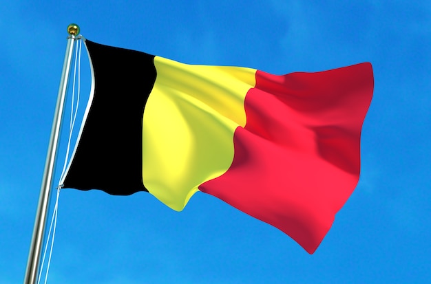 Drapeau de la Belgique sur le fond de ciel bleu