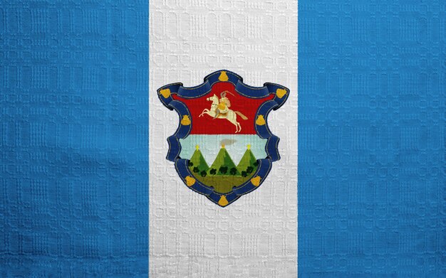 Drapeau et blason de la République du Guatemala sur un fond texturé Collage conceptuel