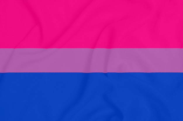 Drapeau De La Communauté De Fierté Bisexuelle Lgbt Sur Un Tissu Texturé. Symbole De Fierté