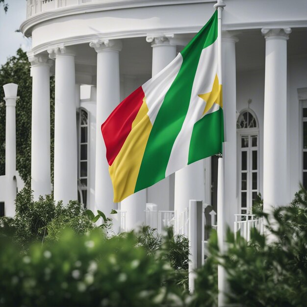 Photo drapeau des comores avec une maison blanche en arrière-plan