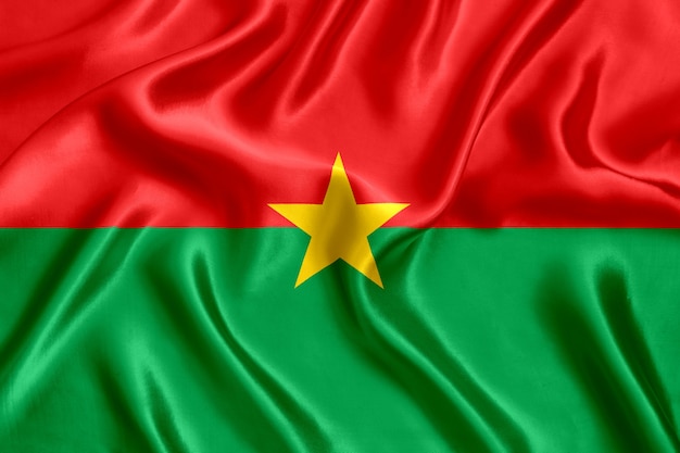 Photo drapeau du burkina faso en soie close-up background