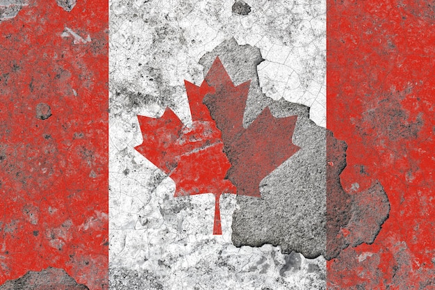 Drapeau du Canada sur une vieille surface de mur en béton endommagée