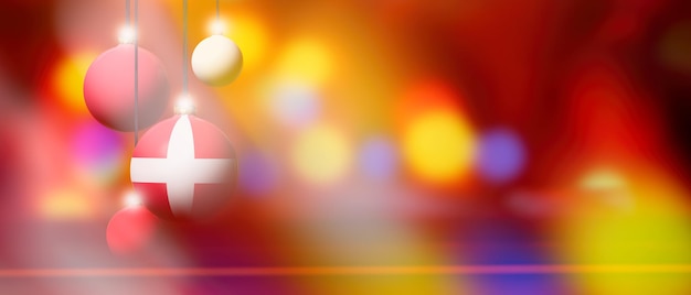 Drapeau du danemark sur boule de noël avec arrière-plan flou et abstrait