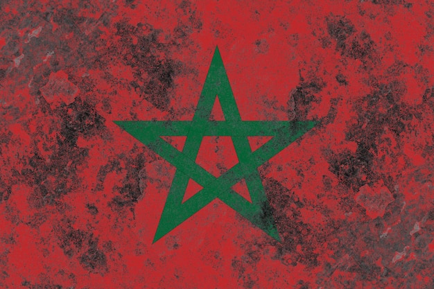 Photo drapeau du maroc sur une vieille surface de mur en béton endommagée