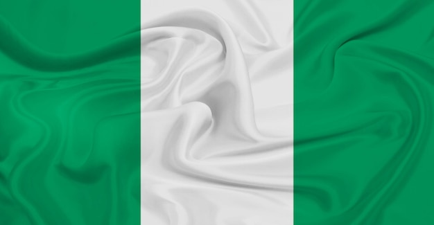 Photo drapeau du nigeria volant dans les airs