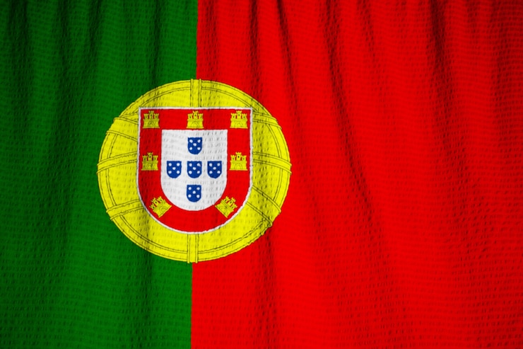 Photo drapeau du portugal souffle dans le vent