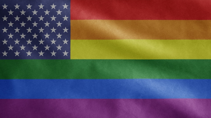 Photo drapeau de la fierté gaie des états-unis dans le vent. bannière de la communauté lgbt des états-unis soufflant de la soie douce. enseigne de texture de tissu en tissu