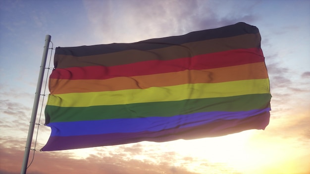 Drapeau de la fierté de Philadelphie dans le vent, le ciel et le soleil. rendu 3D.