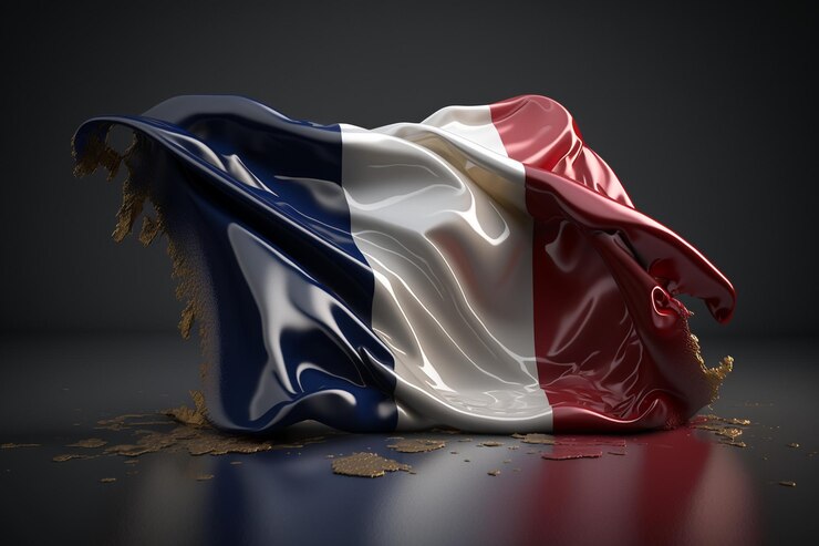 Photo un drapeau de la france est recouvert de sable.