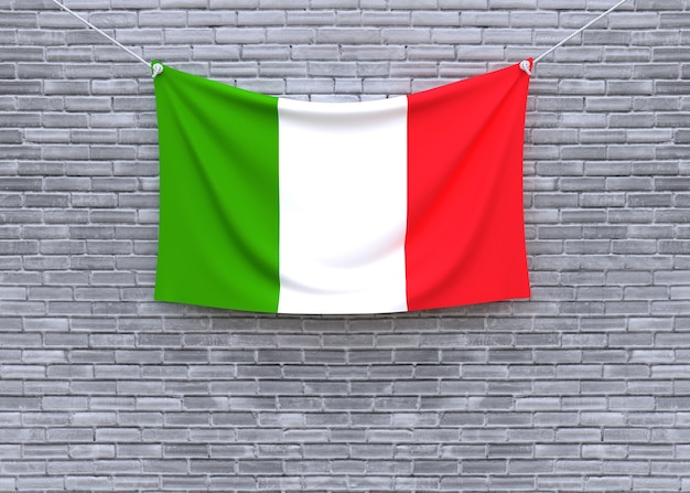 Drapeau italie accroché sur le mur de briques