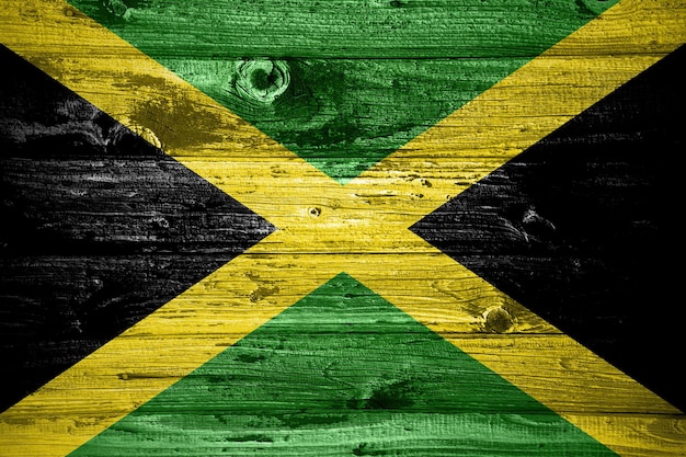 Drapeau jamaïcain sur fond de planches de bois drapeau bois