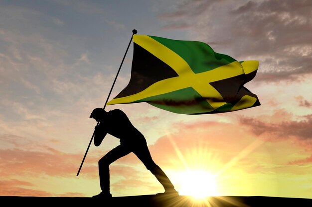 Drapeau jamaïcain poussé dans le sol par une silhouette masculine rendu 3D