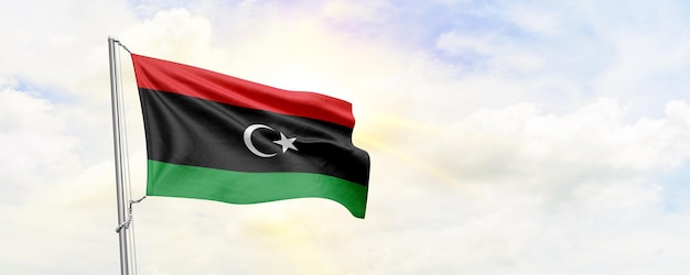 Drapeau libyen agitant sur fond de ciel rendu 3D