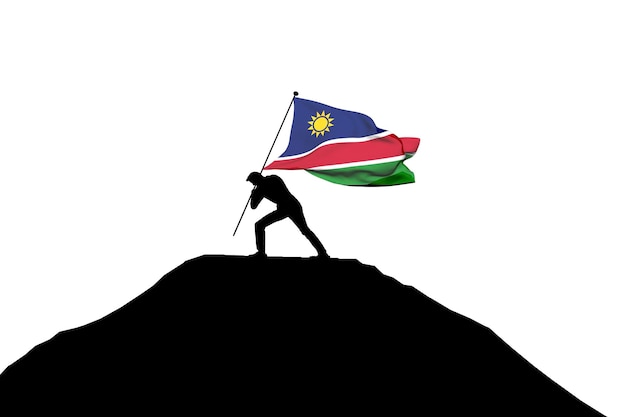 Drapeau de la Namibie poussé au sommet de la montagne par une silhouette masculine rendu 3D
