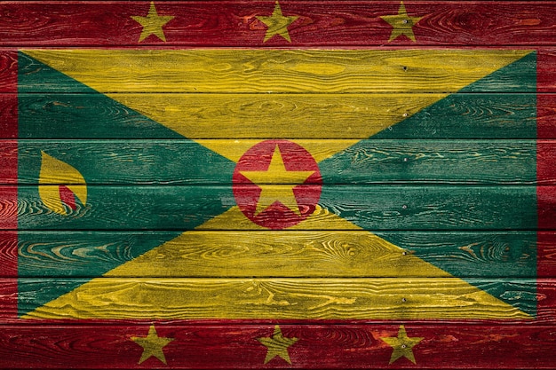 Le drapeau national de la Grenade est peint sur un camp de planches paires clouées avec un clou Le symbole du pays