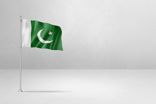 Drapeau pakistanais isolé sur fond de mur en béton blanc