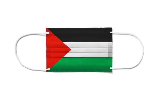 Drapeau de la Palestine sur un masque chirurgical jetable