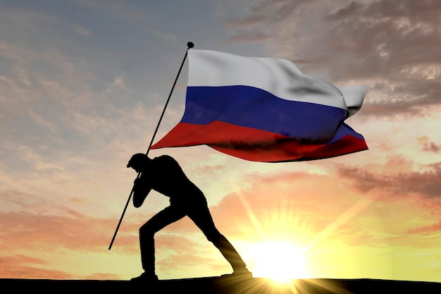 Drapeau de la Russie poussé dans le sol par une silhouette masculine rendu 3D