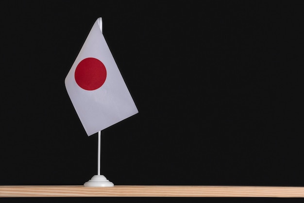 Drapeau de la table nationale du Japon sur fond noir Drapeau blanc avec cercle rouge