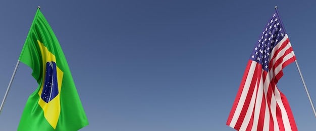 Drapeaux du Brésil et des États-Unis sur des mâts sur fond bleu Drapeaux sur les côtés au centre de l'espace vide Place pour le texte Drapeau brésilien Illustration 3D de l'Amérique