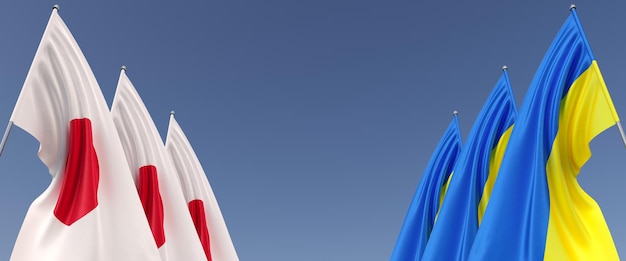Drapeaux du Japon et de l'Ukraine sur des mâts de drapeau sur les côtés Drapeaux sur fond bleu Place pour le texte Indépendant libre Ukraine Trois drapeau japonais Illustration 3D du Commonwealth