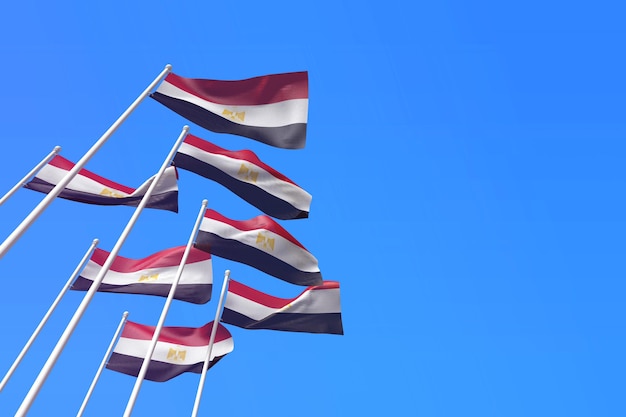 Drapeaux égyptiens agitant au vent contre un rendu de ciel bleu d