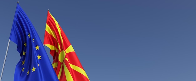 Drapeaux de l'Union européenne et de la Macédoine du Nord sur les mâts de drapeau sur les côtés Drapeaux sur fond bleu Place pour le texte EU Skopje 3d illustration