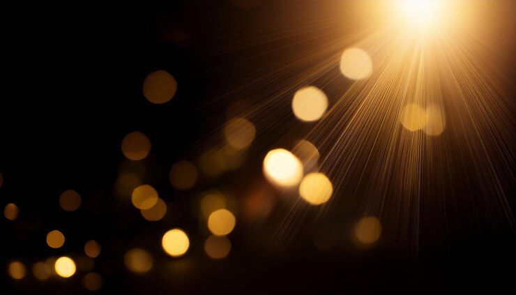 Photo éclairage de lentille dorée abstraite sur fond noir bokeh lumières défocalisées et superposition d'ombre