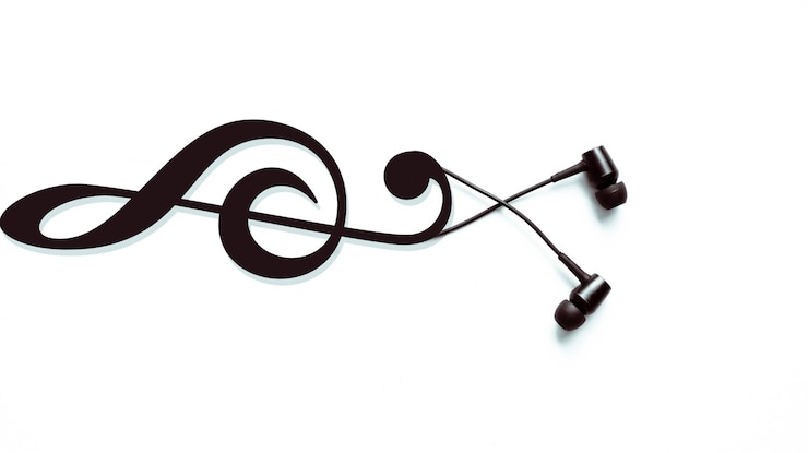 Photo écouteurs avec un symbole de clé. concept de musique moderne. technologie audio.
