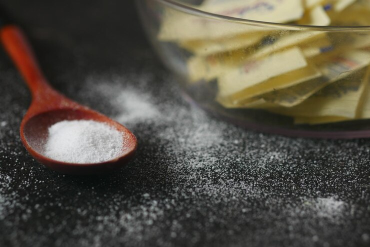 Photo édulcorant substitut de sucre sur fond noir