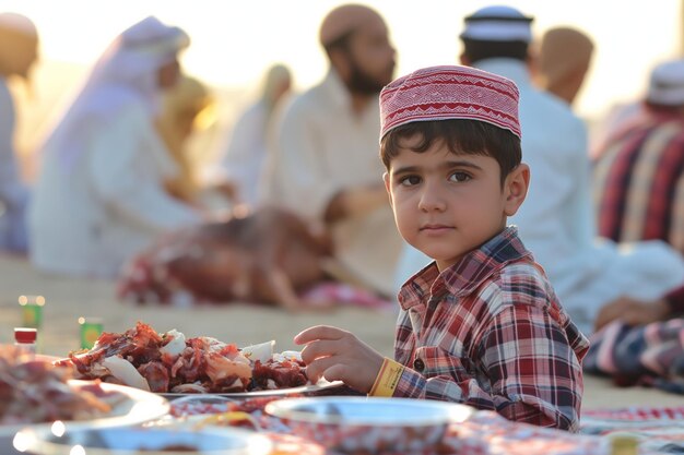 Eid alAdha Jeune garçon à table avec des assiettes de nourriture partageant des recettes lors d'un événement de cuisine