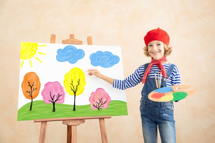 Photo enfant artiste peignant le tableau sur toile.