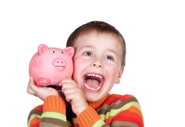 Enfant heureux avec une tirelire bleue