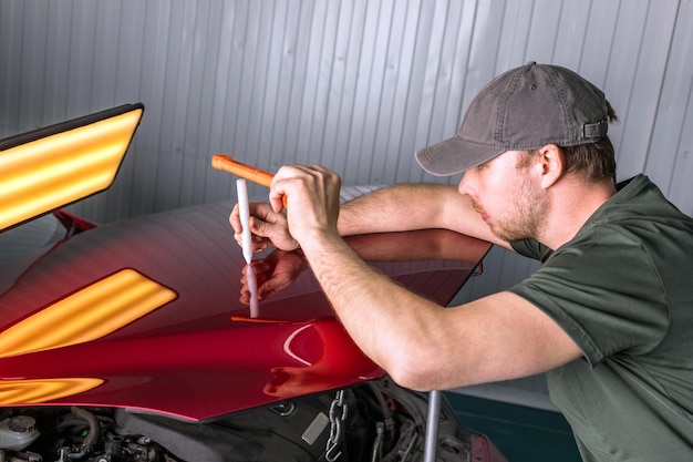 Enlever les bosses sur une carrosserie sans peinture pdr