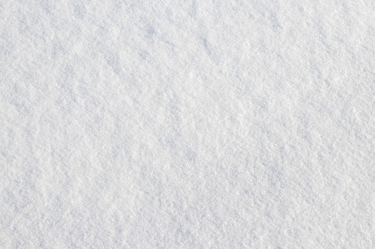 Photo enneigement uniforme. texture de neige sur un terrain plat