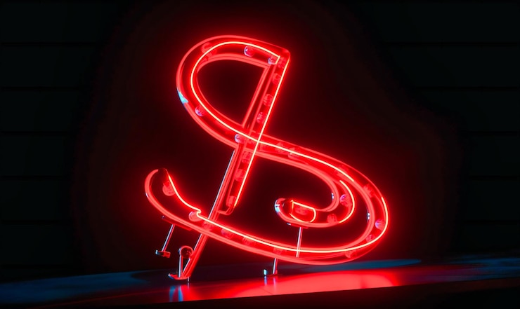 Photo une enseigne au néon rouge montrant une note de musique