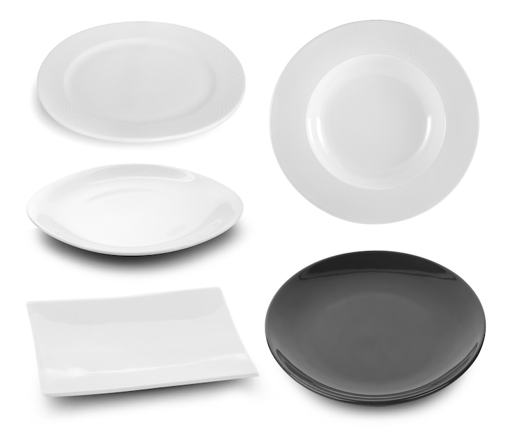 Photo ensemble d'assiettes sur fond blanc