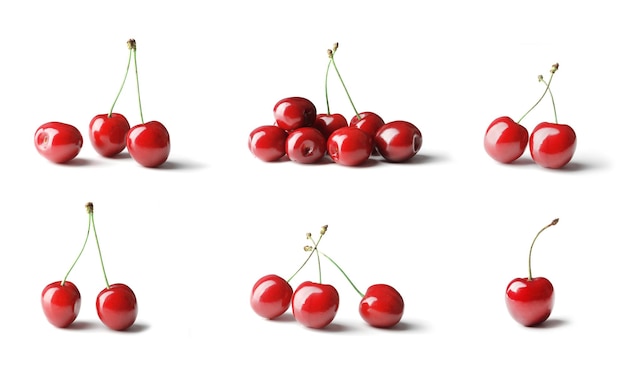 Ensemble de cerises mûres sur fond blanc