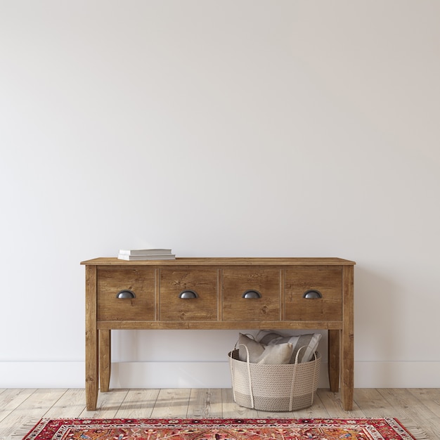 Entrée de ferme avec table console en bois près du mur blanc