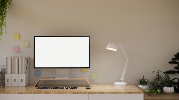 Espace de travail de bureau minimal et confortable avec maquette d'écran d'ordinateur pc moderne