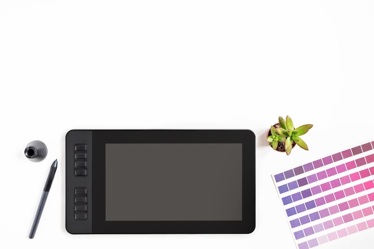 Photo espace de travail design moderne avec tablette graphique, moniteur, clavier, plante succulente sur fond blanc. vue d'en-haut. style plat. espace de copie.
