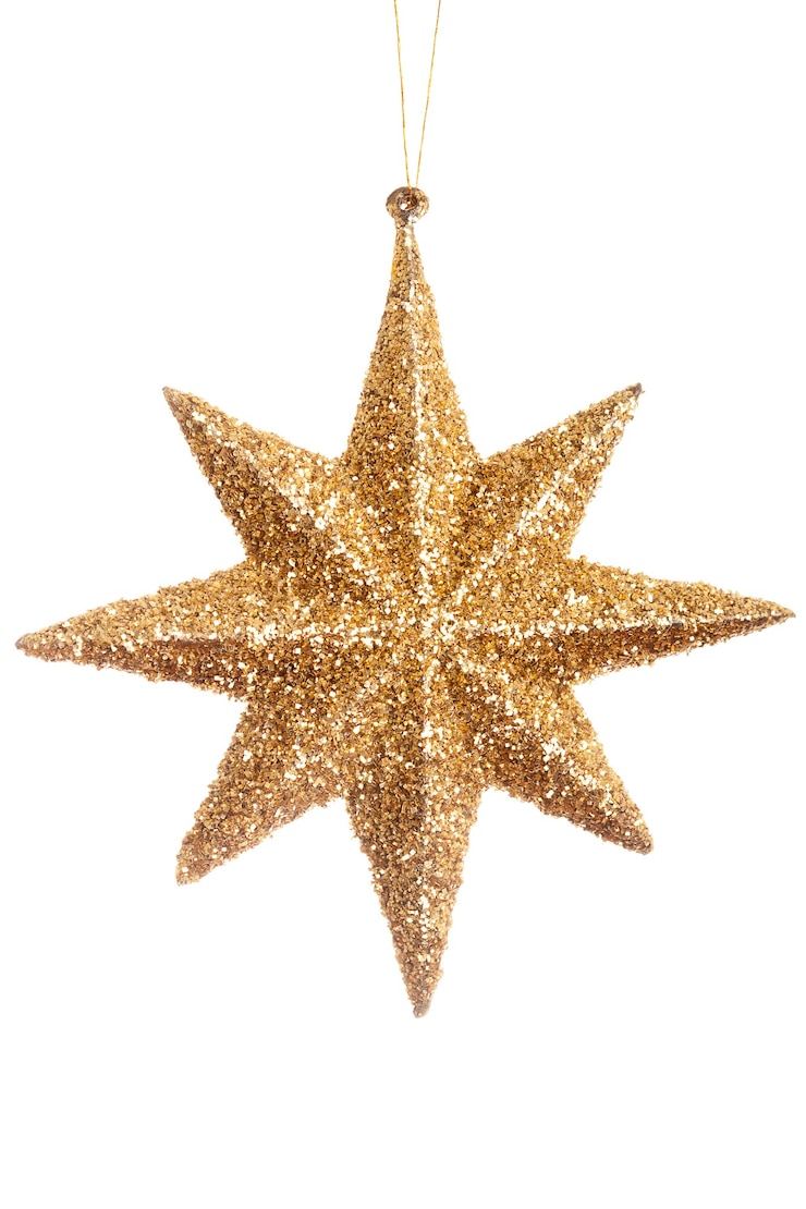 Photo étoile brillante jaune de noël isolée sur fond blanc. studio photo