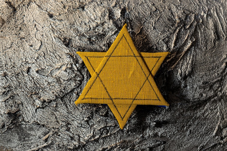 Photo étoile de david sur fond gris texturé concept de l'holocauste