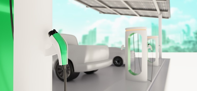 ev parking en charge à la station de charge moderne avec panneaux solaires et ville verte en arrière-plan