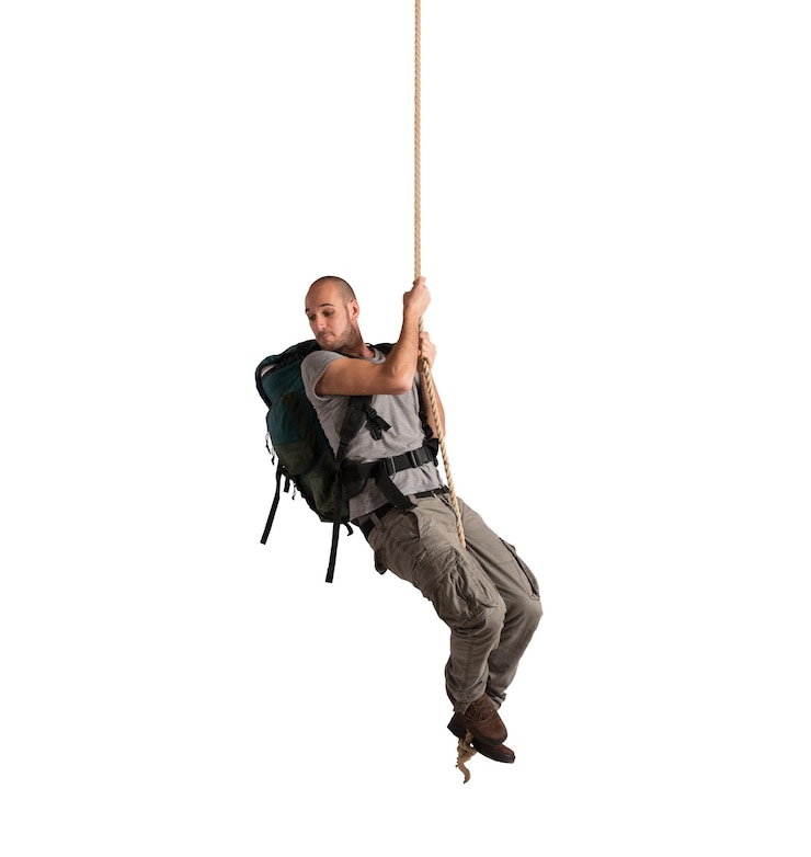Photo explorateur suspendu à une corde