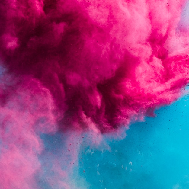 Photo explosion de couleurs holi rose et bleu