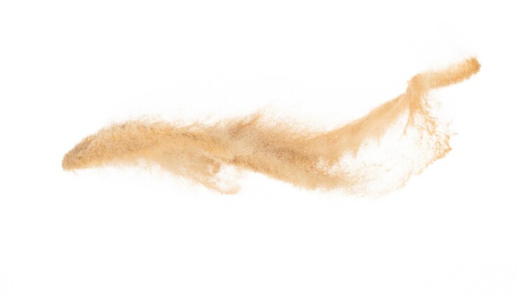 L'explosion du sable volant La vague de sable doré explose Les nuages de sable abstraits volent Le sable de couleur jaune